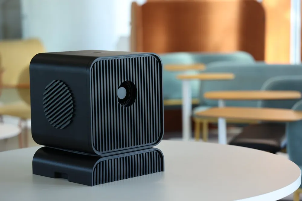 The Local AI Workstation in black on a table in the Empathy.AI lounge.